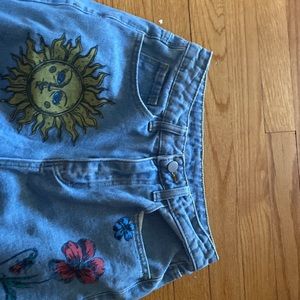 Boot cut bohemian ripped high waisted jeans.